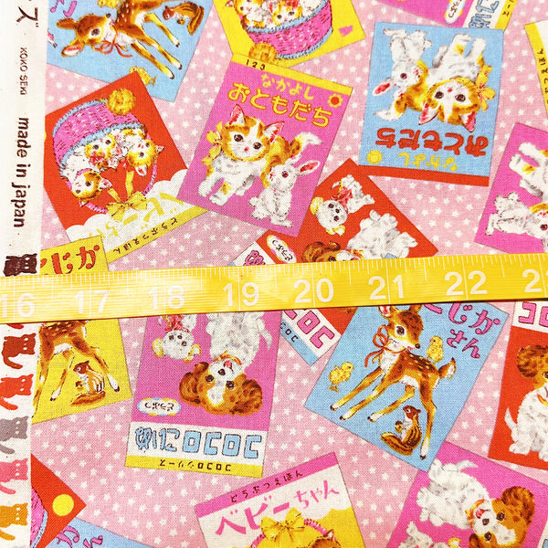 Scale of KoroKoro Animal Picture Books Cotton Fabric in Pink by Koko Seki – quilt-weight cotton with retro animal storybook designs and Japanese text