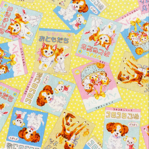 KoroKoro Animal Picture Books Cotton Fabric in Yellow by Koko Seki – quilt-weight cotton with retro animal storybook designs and Japanese text