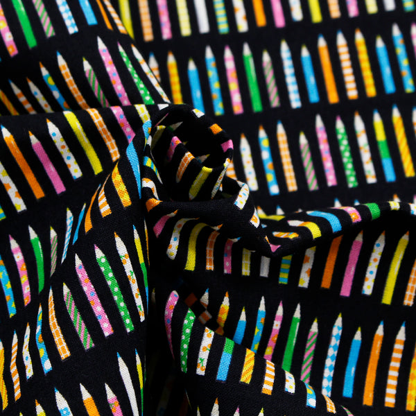 Drape of KoroKoro Pencils Cotton Fabric in Black by Koko Seki – quilt-weight cotton with coordinating pencil design for the KoroKoro Animal Picture Books collection