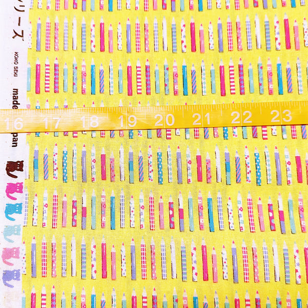 Scale of KoroKoro Pencils Cotton Fabric in Yellow by Koko Seki – quilt-weight cotton with coordinating pencil design for the KoroKoro Animal Picture Books collection