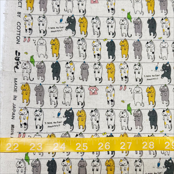 Scale of Laundry Cats canvas fabric in natural by Cotton Kobayashi, cotton linen blend with silly cats on a clothesline