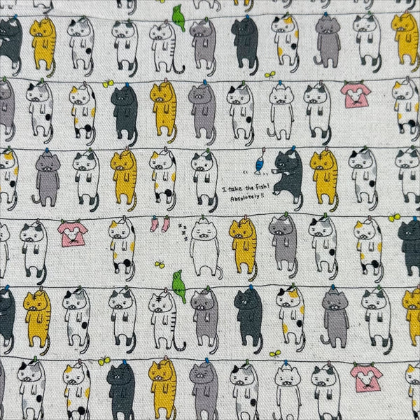 Laundry Cats canvas fabric in natural by Cotton Kobayashi, cotton linen blend with silly cats on a clothesline