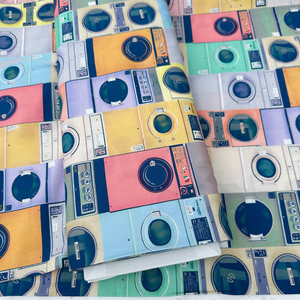 Bolt of Laundry cotton fabric in Pastel by Nora featuring retro laundry machines in soft mid-century modern pastel colors on quilt-weight cotton