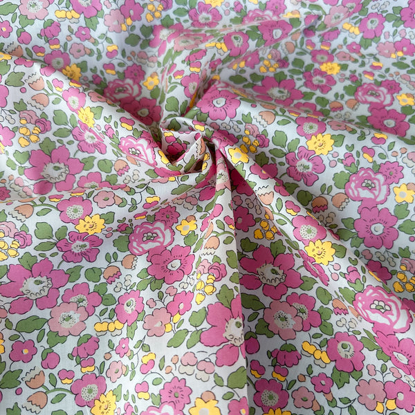 Betsy Tana Lawn fabric by Liberty Fabrics shown draped, Pink Light Neon