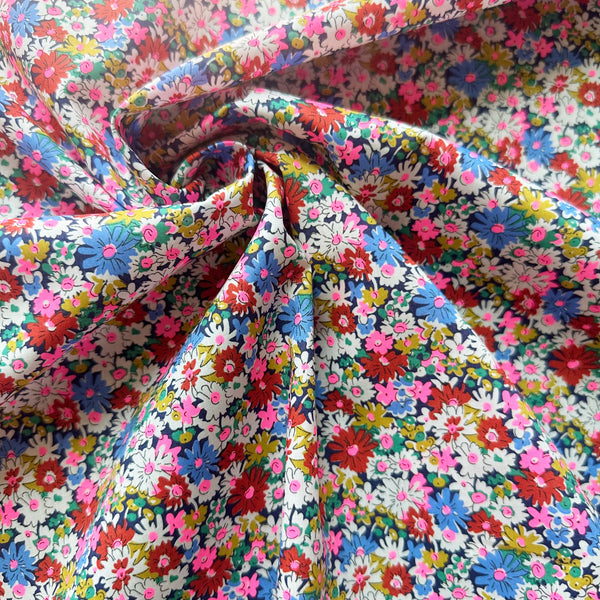 Libby Tana Lawn fabric by Liberty Fabrics shown draped, Multibright Neon