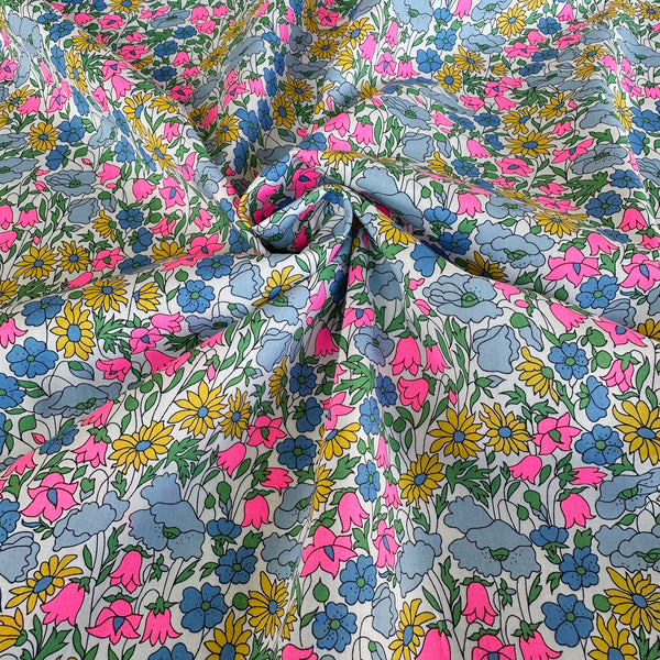 Poppy and Daisy Tana Lawn fabric by Liberty Fabrics shown draped, Multipast Neon