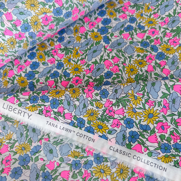Selvage detail of Liberty Fabrics Poppy and Daisy Tana Lawn fabric, Multipast Neon colorway