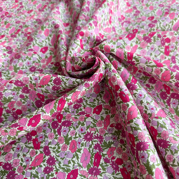 Poppy Forest Tana Lawn fabric by Liberty Fabrics shown draped, Pink