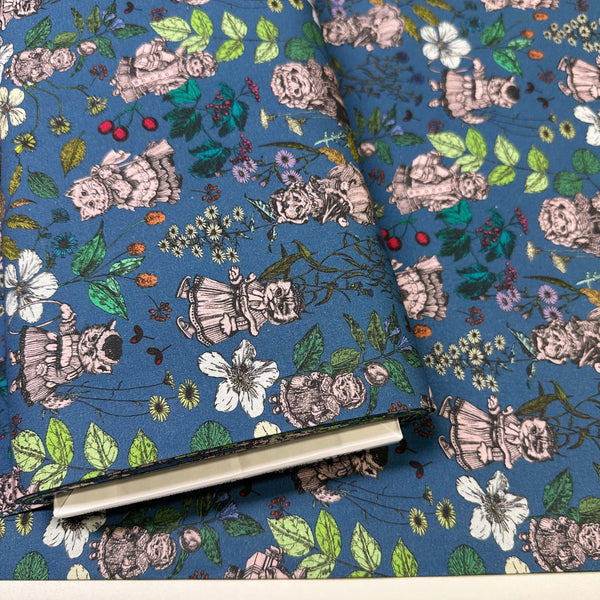 Bolt of Liminal Garden Cats Cotton Fabric in Aegean Blue by Nora – whimsical cats dressed as humans in a garden setting on quilt-weight cotton