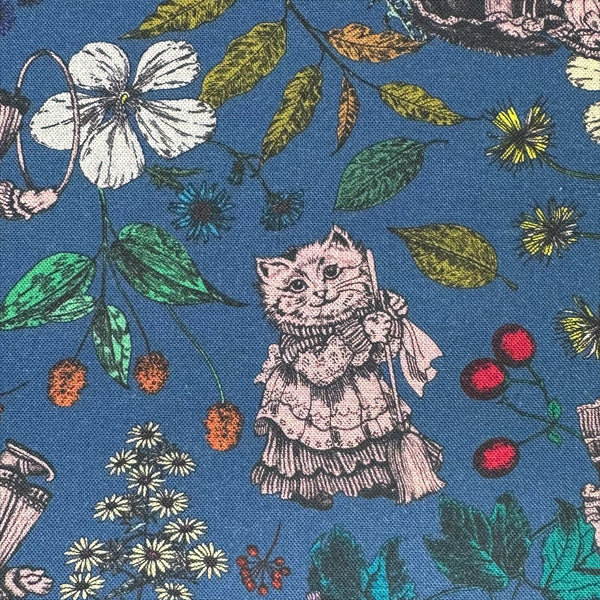 Close up of Liminal Garden Cats Cotton Fabric in Aegean Blue by Nora – whimsical cats dressed as humans in a garden setting on quilt-weight cotton