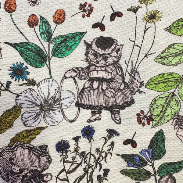 Close up of Liminal Garden Cats Cotton Fabric in Natural by Nora – whimsical cats dressed as humans in a garden setting on quilt weight cotton