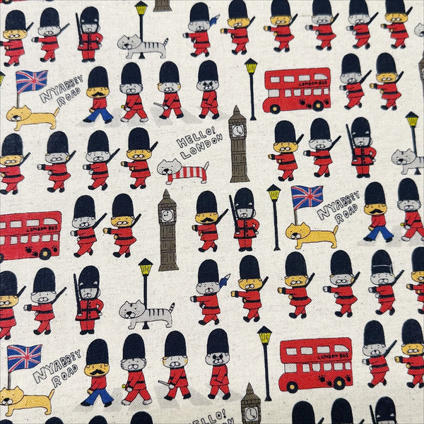 London Cats canvas fabric in natural cotton linen blend by Cotton Kobayashi featuring cats as royal guards