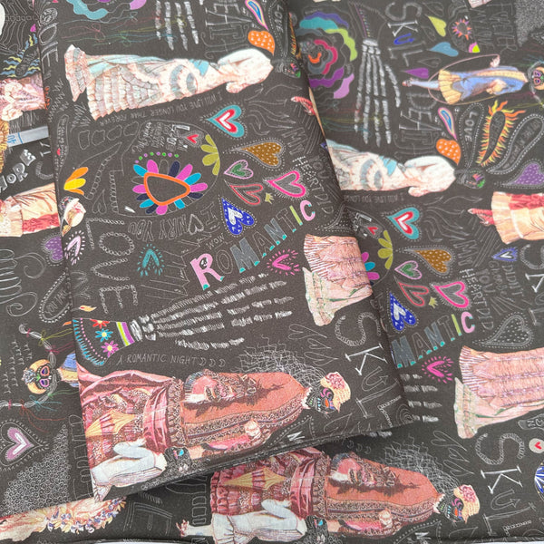 Bolt of Longer Than Eternity cotton fabric in Dark Umber by Nora featuring a love-themed Victorian skeleton print on quilt-weight cotton