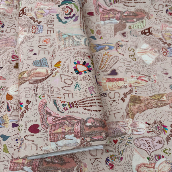 Bolt of Longer Than Eternity cotton fabric in tan by Nora featuring a love-themed Victorian skeleton print on quilt-weight cotton