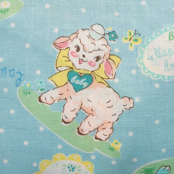 Close up of Lovely Animal cotton fabric by Yuwa in pale blue and aqua, AT826599 D