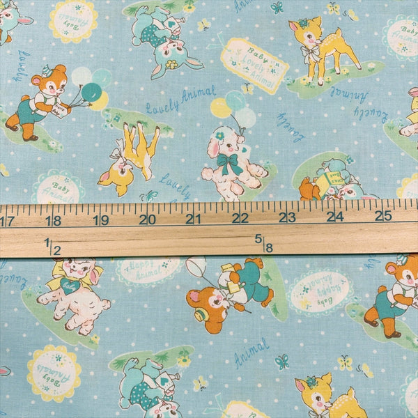 Scale of Lovely Animal cotton fabric by Yuwa in pale blue and aqua, AT826599 D
