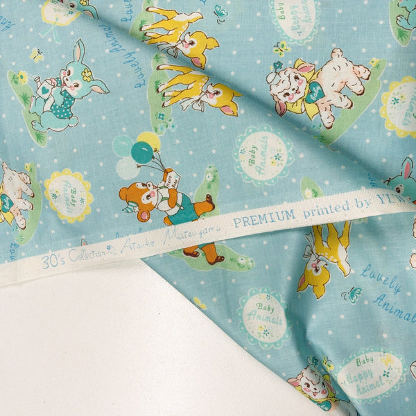 Selvage of Lovely Animal cotton fabric by Yuwa in pale blue and aqua, AT826599 D