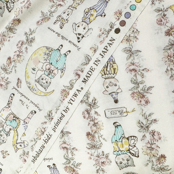 Selvage of Magical Wonderland Cotton fabric by Yuwa Fabrics, in white