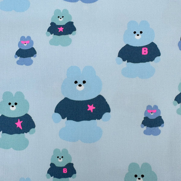 Close up of Mellow Friends Kuma Cotton Oxford Fabric in Light Blue featuring cute bears in shirts and hoodies with neon accents, imported from Japan.