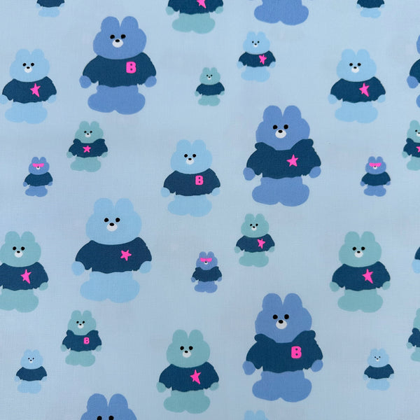 Mellow Friends Kuma Cotton Oxford Fabric in Light Blue featuring cute bears in shirts and hoodies with neon accents, imported from Japan.