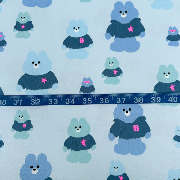 Scale of Mellow Friends Kuma Cotton Oxford Fabric in Light Blue featuring cute bears in shirts and hoodies with neon accents, imported from Japan.