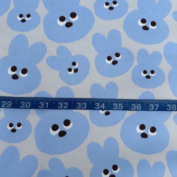 Scale of Mellow Friends Usagi Cotton Oxford Fabric in Blue featuring cute bunny faces in a playful print, imported from Japan.