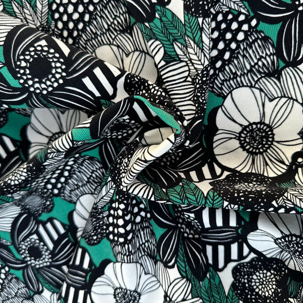Drape of Modern Nordic Flower corduroy fabric by Cotton Kobayashi in green