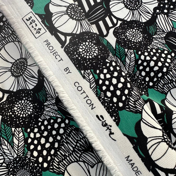 Selvage of Modern Nordic Flower corduroy fabric by Cotton Kobayashi in green