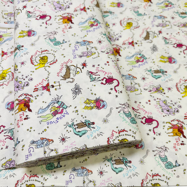Bolt of My Star Sign Cotton Fabric in Natural by Nora – quilt-weight cotton featuring illustrated zodiac-themed designs