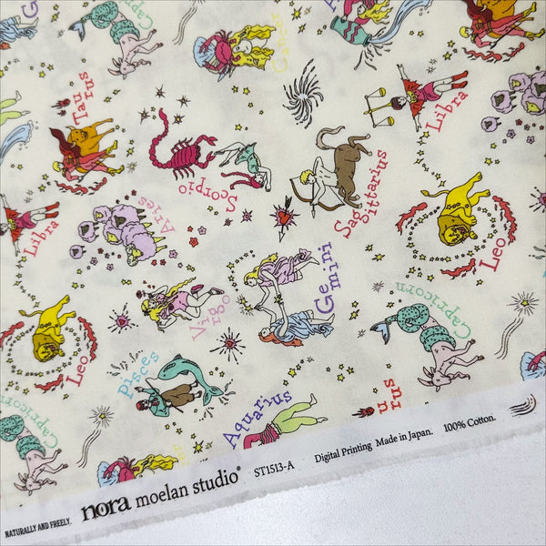 Selvage of My Star Sign Cotton Fabric in Natural by Nora – quilt-weight cotton featuring illustrated zodiac-themed designs
