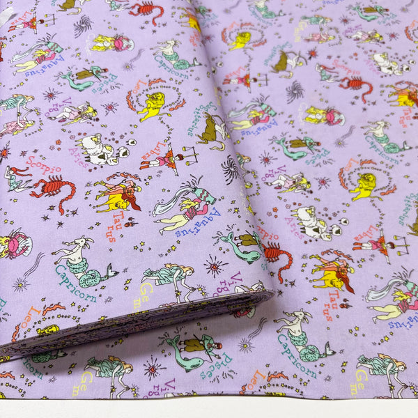 Bolt of My Star Sign Cotton Fabric in Purple by Nora – quilt-weight cotton featuring illustrated zodiac-themed designs