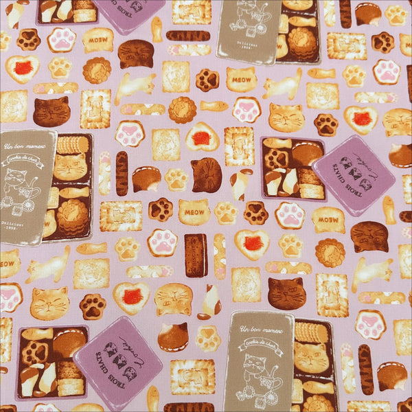 Neko Cookie Can cotton Oxford fabric by Komu Strada featuring cat-shaped cookies, biscuits, and cookie tins on a pink background