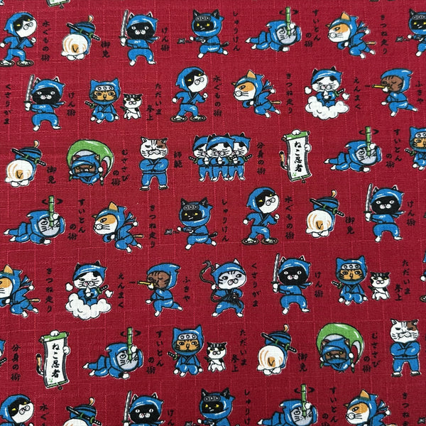 Neko Ninja cotton dobby fabric in crimson by Cosmo Textiles Imported from Japan
