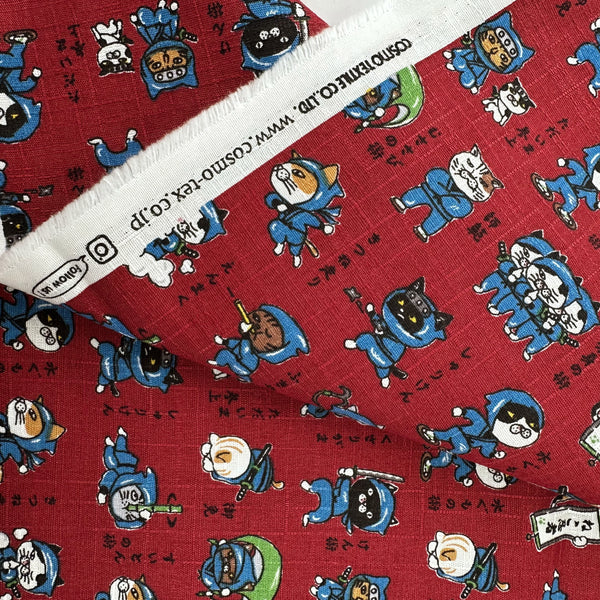 Selvage of Neko Ninja cotton dobby fabric in crimson by Cosmo Textiles Imported from Japan