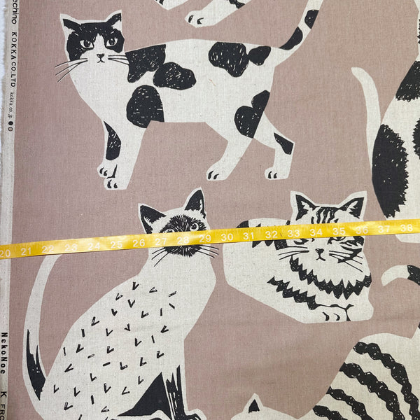 NekoNoe Echino Cat Cotton Linen Canvas Fabric by Etsuko Furuya for Kokka Japan, featuring playful cat designs in sand and black