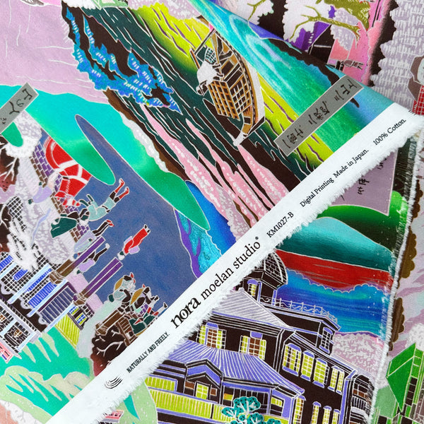 Selvage of Neo Japanesque cotton fabric in Bright Multi by Nora featuring a brightly colored Japanese landscape with mountains, villages, and traditional motifs on quilt-weight cotton