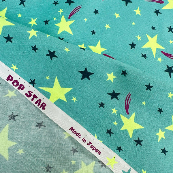Selvage detail of Neon Pop Star Cotton fabric, Green colorway, imported from Japan