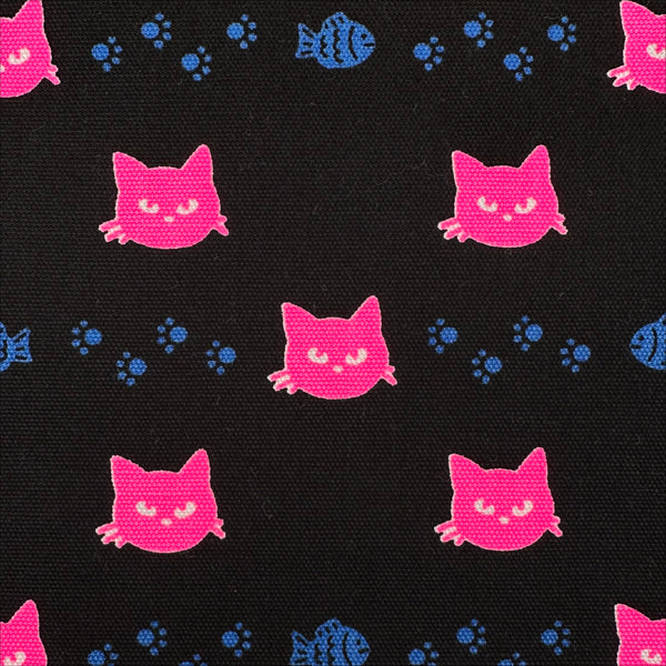 Close up of Neon Cat Cotton Oxford Fabric in Black featuring a playful print of fish, paws, and neon cat faces, imported from Japan.