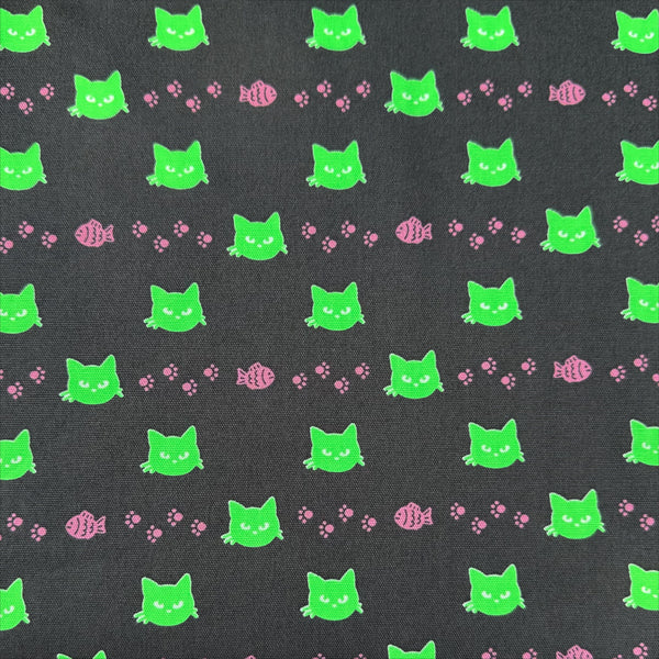 Neon Cat Cotton Oxford Fabric in Charcoal featuring a playful print of fish, paws, and neon cat faces, imported from Japan.