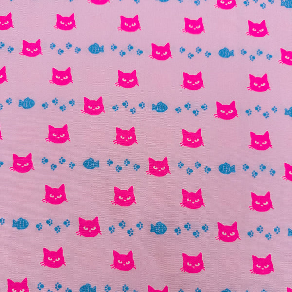 Neon Cat Cotton Oxford Fabric in Pink featuring a playful print of fish, paws, and neon cat faces, imported from Japan.