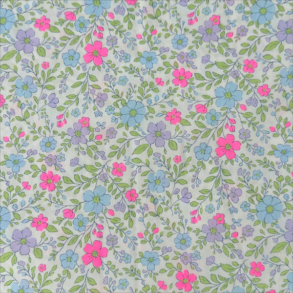 Neon Flower Cotton Broadcloth Fabric in Natural featuring a vibrant floral print with neon accents, imported from Japan.