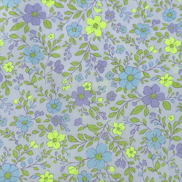 Neon Flower Cotton Broadcloth Fabric in Purple featuring a vibrant floral print with neon accents, imported from Japan.
