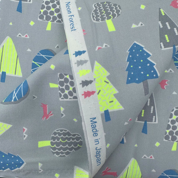 Selvage of Neon Forest Cotton Oxford Fabric in Gray featuring a forest-inspired print with neon colors, imported from Japan.