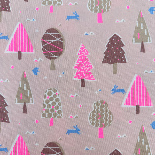 Close up of Neon Forest Cotton Oxford Fabric in Pink featuring a vibrant forest-inspired print with neon colors, imported from Japan.