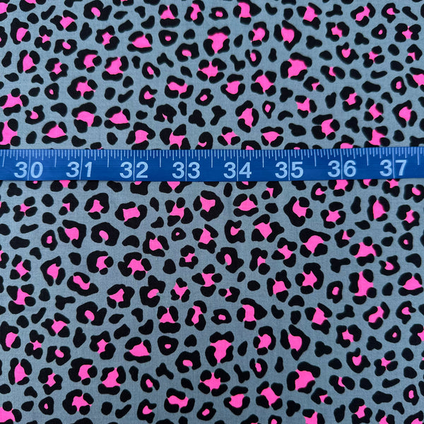 Scale of Neon Leopard Cotton Fabric in Gray and Neon Pink featuring a bold leopard print with neon accents, imported from Japan.