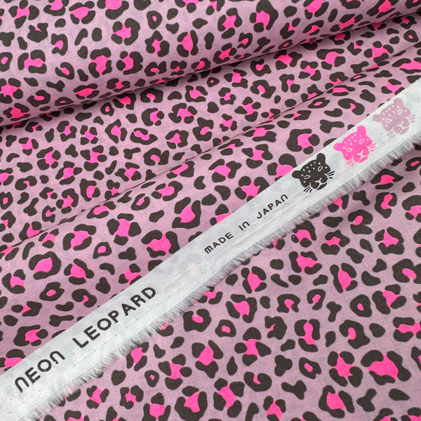 Selvage of Neon Leopard Cotton Fabric in Pink featuring a bold leopard print with neon accents, imported from Japan.