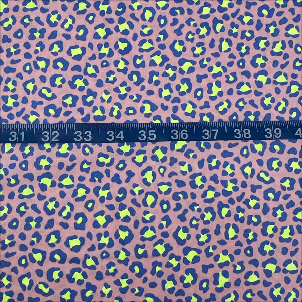 Scale of Neon Leopard Cotton Fabric in Purple featuring a bold leopard print with neon accents, imported from Japan.