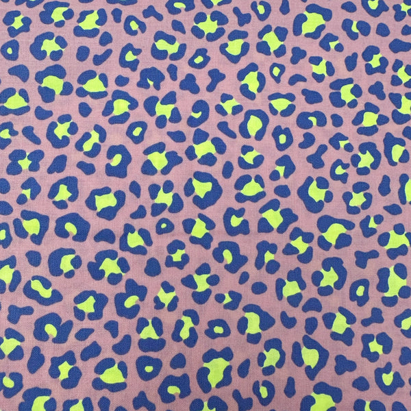 Neon Leopard Cotton Fabric in Purple featuring a bold leopard print with neon accents, imported from Japan.