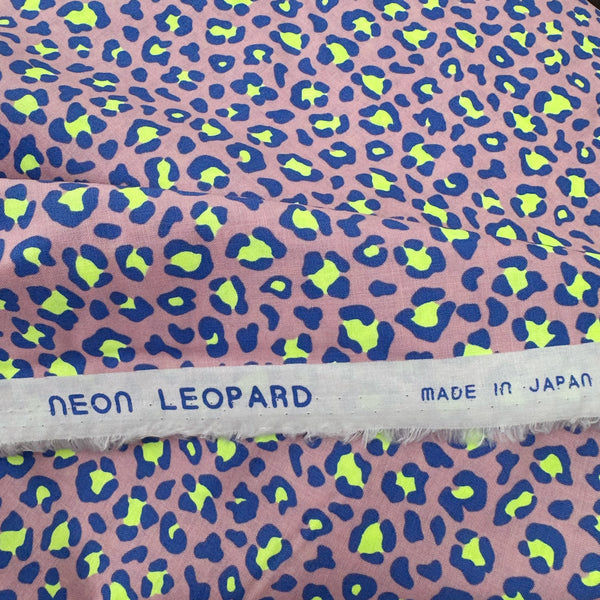 Selvage of Neon Leopard Cotton Fabric in Purple featuring a bold leopard print with neon accents, imported from Japan.