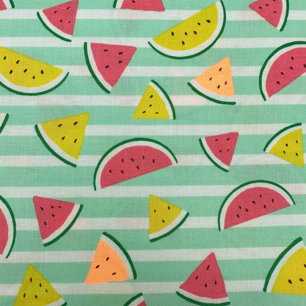 Close up of Neon Watermelon Cotton Fabric in Mint featuring a bright watermelon print with neon accents, imported from Japan.